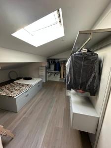 a bedroom with a bed and a skylight at The Loft in Castel San Pietro Terme