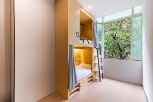 Postel nebo postele na pokoji v ubytování Guangzhou Xingdu International Youth Hotel Apartment Hostel-Near Canton Fair And Canton Tower + 50 fotografií