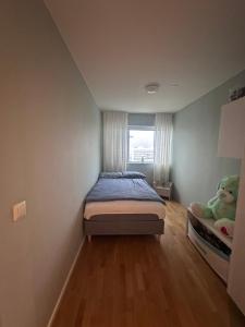 Ένα ή περισσότερα κρεβάτια σε δωμάτιο στο Nordlys Luxury Flat