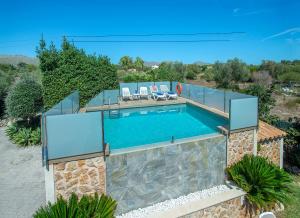 an image of a swimming pool in a villa at Owl Booking Villa Rafale - 5 Min Drive to The Beach in El Port