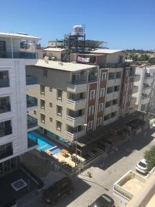 an aerial view of a building with a parking lot at Baskent Otel in Didim
