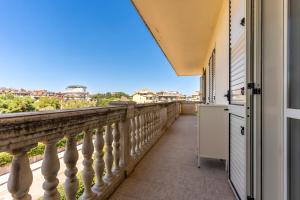 a balcony with a view of the city at Cariddi in Caulonia Marina