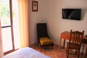 TV a/nebo společenská místnost v ubytování Hostal la zamora