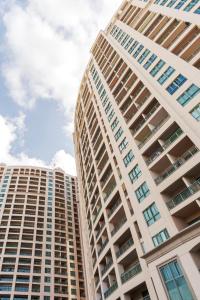 a tall apartment building with the sky in the background at Nabeel Homes - Four Seasons City View Residence in Alexandria