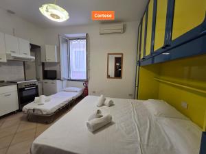 Postel nebo postele na pokoji v ubytování Cavaliere - By Ligooria