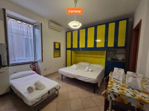 Postel nebo postele na pokoji v ubytování Cavaliere - By Ligooria