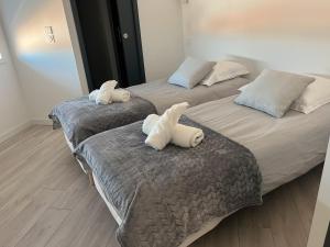 Katil atau katil-katil dalam bilik di Appartement face à la mer 3
