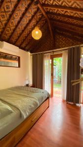 Ένα ή περισσότερα κρεβάτια σε δωμάτιο στο Banana surf and stay