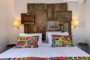 a bedroom with two beds and two pillows at Sitio dos Cavaleiros Daily Serviced Apartments in Lisbon +151 photos