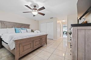 a bedroom with a bed and a ceiling fan at Family Retreat with Heated Pool, Playground, Ping Pong Table in Jasmine Estates +42 photos