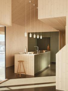 a kitchen with a sink and a counter top at Architect-Designed Cabin With Lake Mylla Views in Roa