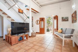 a living room with a fireplace and a couch at Villa Beau Rivage in La Moïse