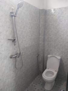 a bathroom with a shower and a toilet at Al houda in Dakar