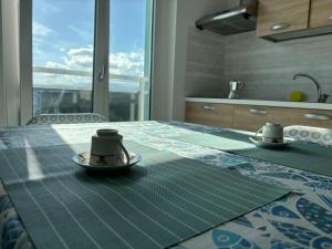 a table with two tea cups on top of it at Al Bivio Blu in Chieti