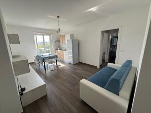 a living room with a couch and a table at Al Bivio Blu in Chieti