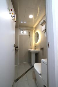 a bathroom with a toilet and a sink at Stay107 in Seoul