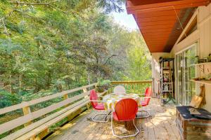 a patio with a table and chairs on a porch at Quiet All-Season Creekside Escape in Upstate! in North Hancock