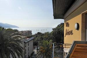 a view of the ocean from a balcony of a building at Hotel Villa Adriana in Monterosso al Mare
