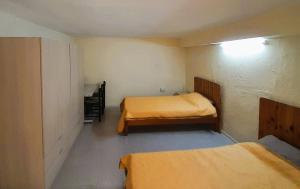 a small room with two beds in it at Bright & Spacious Private Room, Bathroom & Terrace in Swieqi, Prime Location! in Is-Swieqi +2 photos