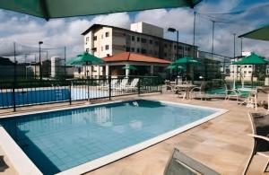 a large swimming pool on top of a building at Apartamento cop 30 in Marituba