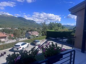a balcony with a car parked in a parking lot at Casa Colle Verde in Conocchia