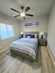 a bedroom with a bed and a ceiling fan at StarLuxe Stay and Play in Star