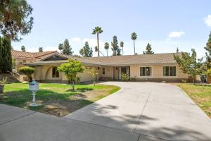 a house with a driveway in front of it at Oak and Fairway in Riverside