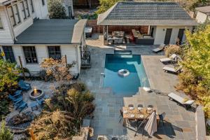 an overhead view of a backyard with a swimming pool at Pool Outdoor TV Fire Pit Game Room in Memphis +31 photos