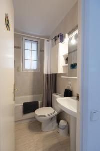 a bathroom with a toilet and a sink at Lovely house in Bellaterra (10 min to UAB) in Cerdanyola del Valles