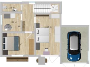 a floor plan of a house with a car at Haus Maria in Oberndorf in Tirol