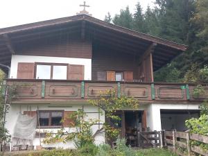 a house with a cross on top of it at Haus Maria in Oberndorf in Tirol