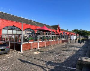 a red building with aasteryasteryasteryasteryasteryasteryasteryasteryasteryasteryastery at Harbour Horizons in Edinburgh