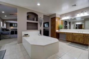 a large bathroom with a tub and a sink at Spacious 5BR Retreat Pool Grill 15 Min to Westgate in Litchfield Park