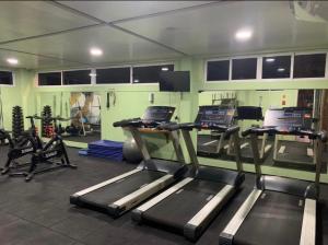 a gym with two treadmills in a room at FLAT EM BARREIRINHAS - Gran Solare Lencois in Barreirinhas