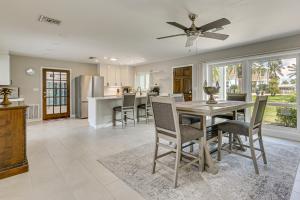 a kitchen and dining room with a table and chairs at Waterfront Retreat with Boat Dock and Yard in Ft Myers in Iona