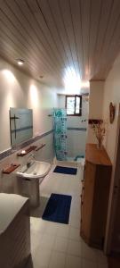 a bathroom with a sink and a mirror at Le Mas in Entrechaux +17 photos
