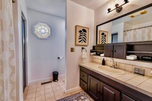 a bathroom with a sink and a mirror at 17 Min to NRG | Grill | Huge Yard | Private | Cozy in Oak Hill +45 photos