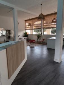 a room with a kitchen and a living room at Notre location au Barcarès in Le Barcarès
