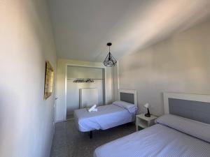 Ένα ή περισσότερα κρεβάτια σε δωμάτιο στο Departamento Punta-Portil +25 φωτογραφίες