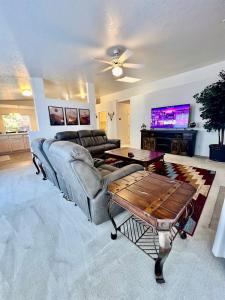 a living room with a couch and a table at Large Prescott Home with 3-car Garage Central & Quiet in Prescott