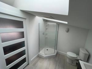 a bathroom with a shower and a toilet at Unique private room and bath in Halifax