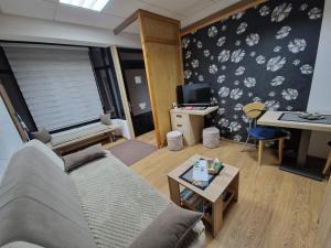 a living room with a couch and a table at Apartment Čolović in Raška
