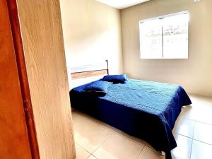 Ένα ή περισσότερα κρεβάτια σε δωμάτιο στο Residencial Villa Del Mare