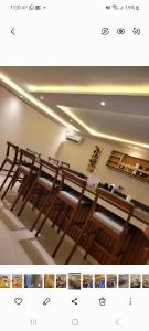 a picture of a church with a row of wooden benches at B&B Klomiabla in San-Pédro +189 photos
