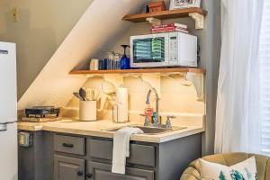 a kitchen with a sink and a microwave at Cozy Ludlow Escape in Ludlow
