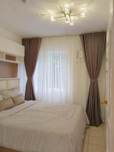 Postel nebo postele na pokoji v ubytování 2 Bedroom Condo at Centro Spatial at the Heart of Davao City