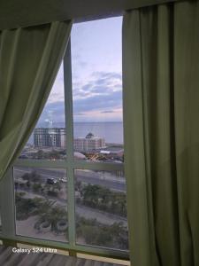 a view of the ocean from a hotel window at Квартира in Aktau