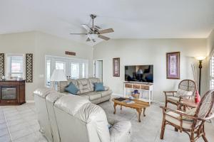 a living room with a couch and a table at Dog-Friendly Home, Lake Henderson Across Street! in Inverness