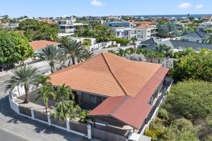 an aerial view of a house with an orange roof at Villa CuraSea in Jan Thiel