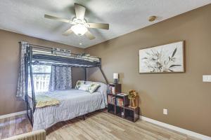 a bedroom with a bed with a ceiling fan at Dog-Friendly Home, Lake Henderson Across Street! in Inverness +20 photos
